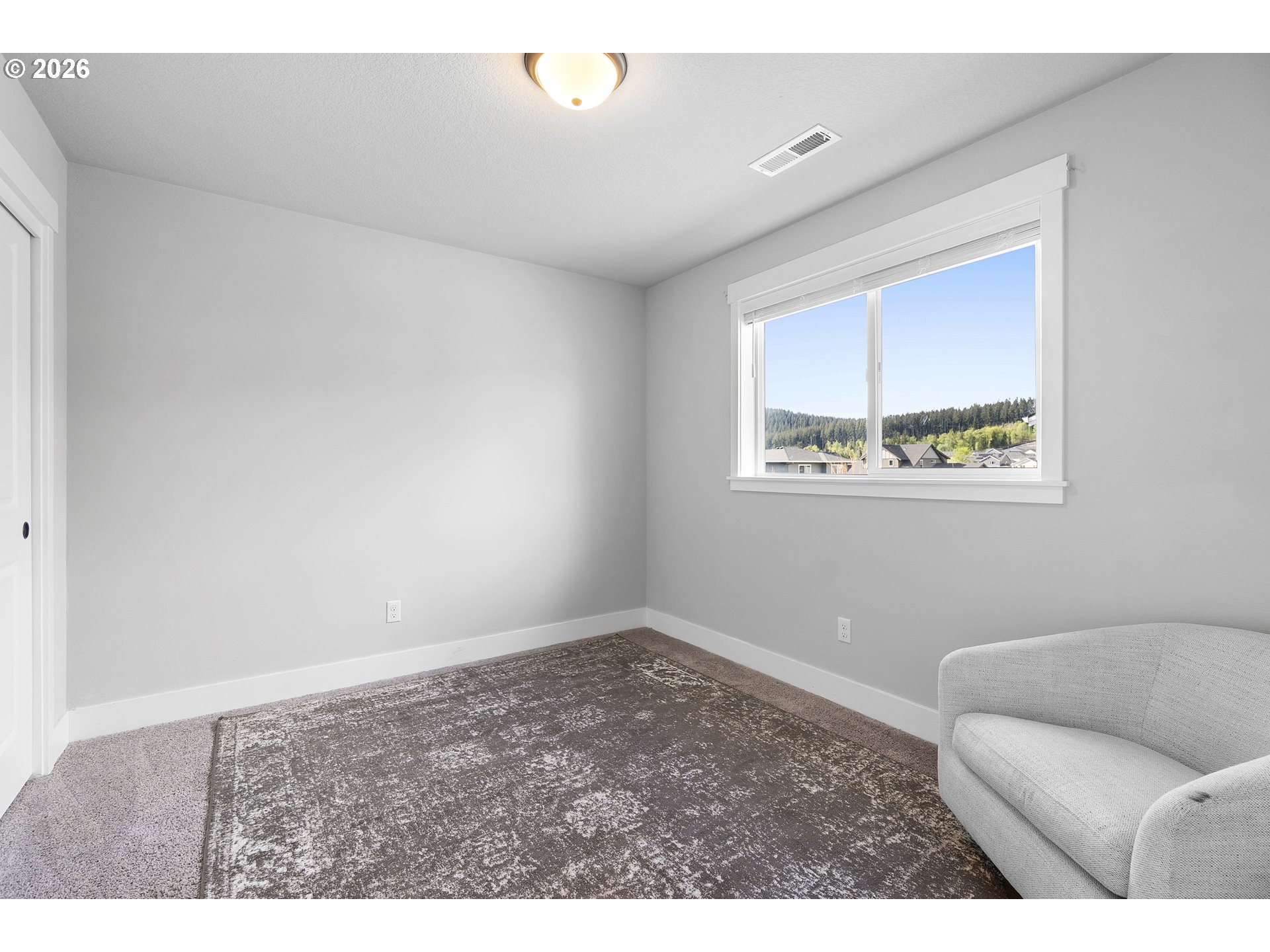 5788 North 86th Circle Camas, WA 98607 - Photo 15 of 26 a living room with furniture and a window