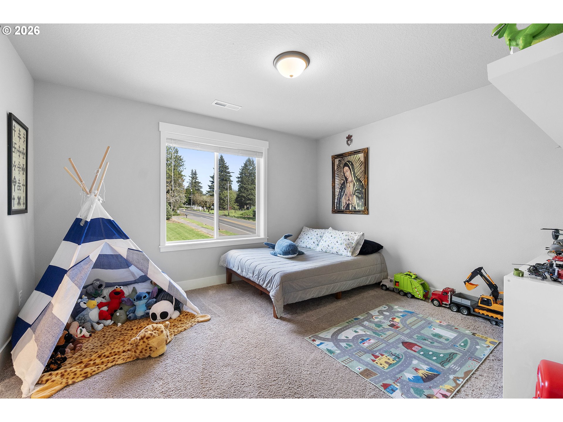 5788 North 86th Circle Camas, WA 98607 - Photo 16 of 26 a bedroom with furniture and a bed