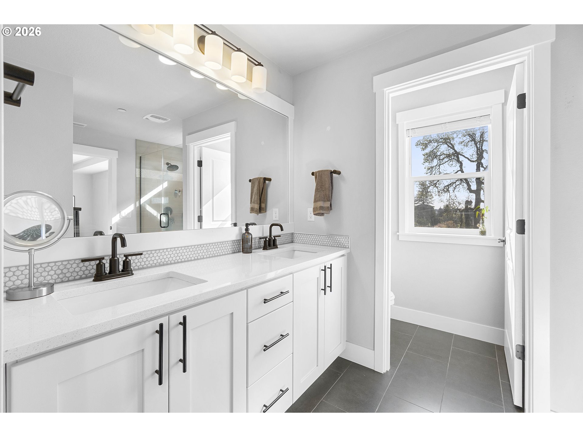 5788 North 86th Circle Camas, WA 98607 - Photo 18 of 26 a bathroom with a double vanity sink and a mirror