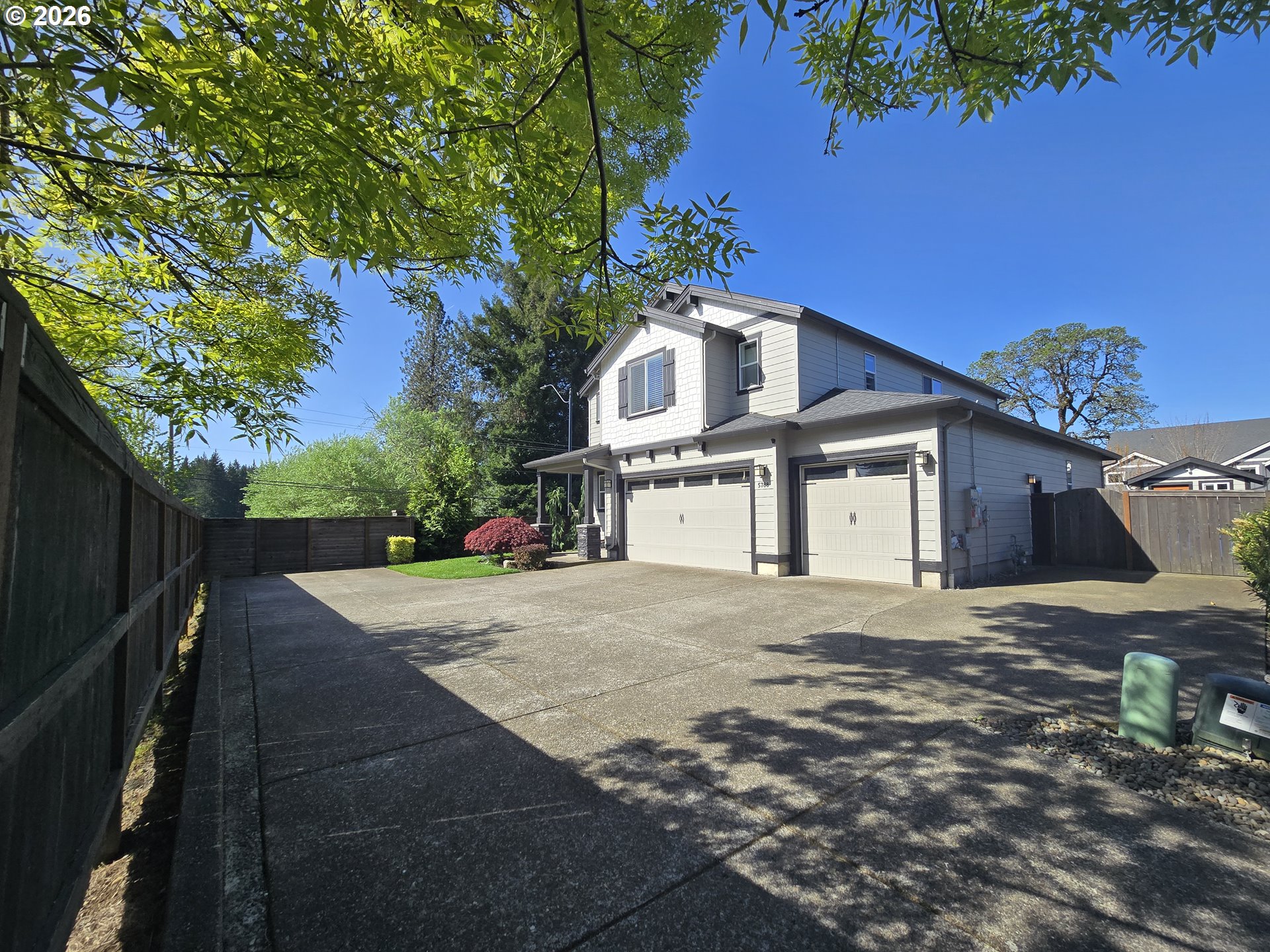 5788 North 86th Circle Camas, WA 98607 - Photo 2 of 26 a front view of a house with a yard and garage