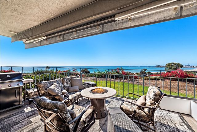 a view of a chairs and table in patio