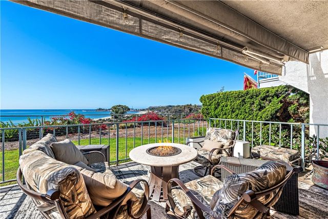 a view of a chairs and table in patio