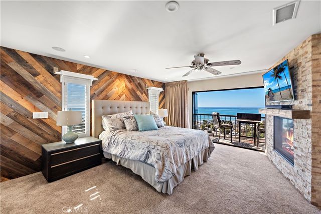 a bedroom with a bed and a ceiling fan