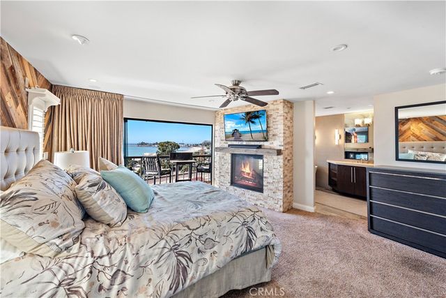 a bedroom with furniture and a flat screen tv