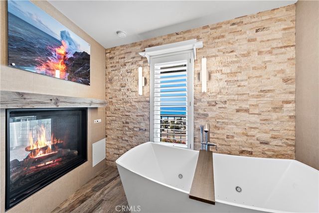 a bathroom with a tub and a sink