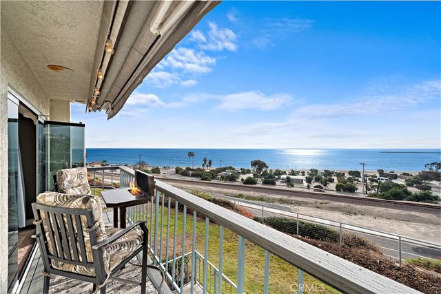 a view of a balcony with furniture