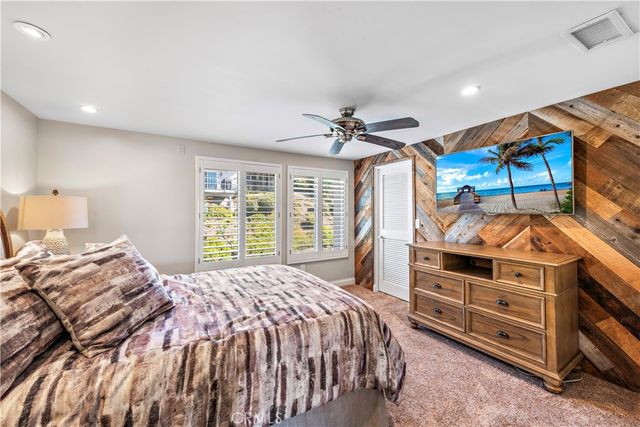 a bedroom with a bed and a walk in closet