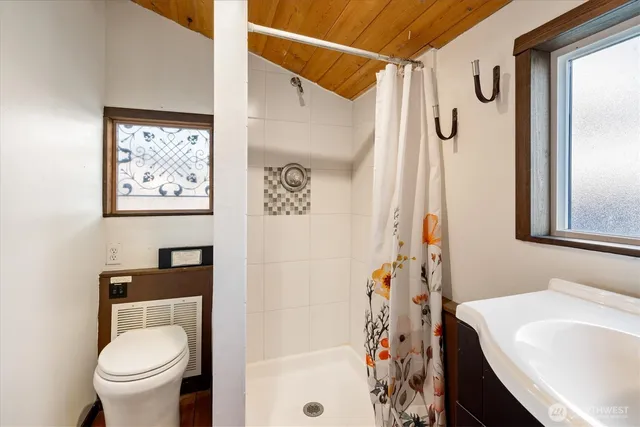 a bedroom with bed and window