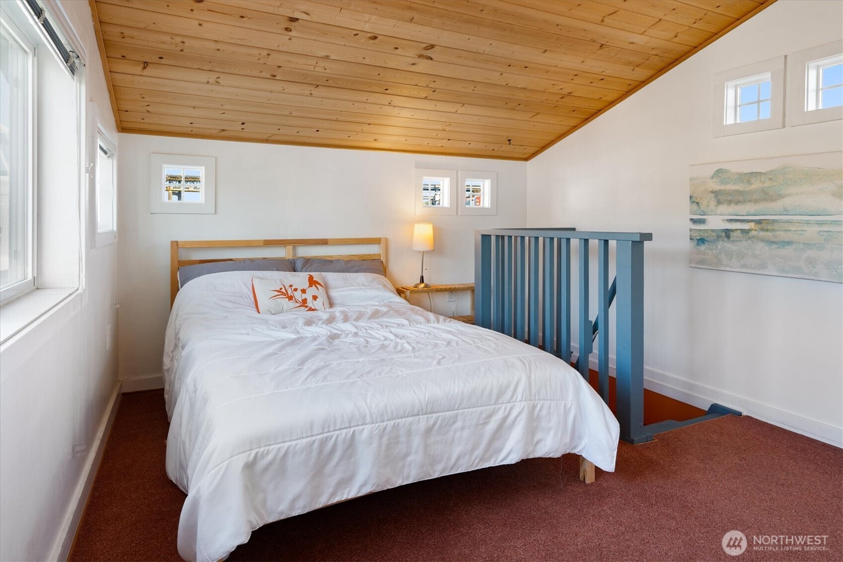 2401 North Northlake Way, Unit L6 Seattle, WA 98103 - Photo 18 of 30 a bed sitting in a bedroom next to a window