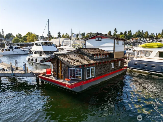 a view of a house with pool and chairs