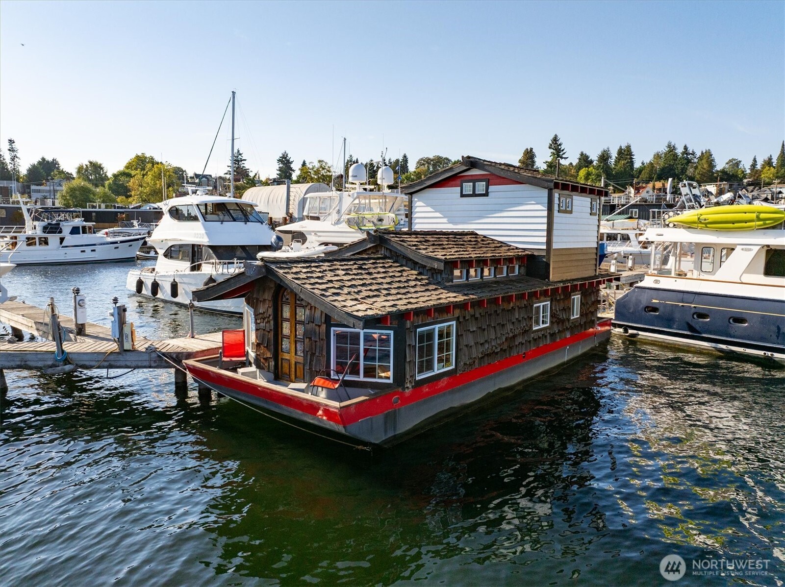 2401 North Northlake Way, Unit L6 Seattle, WA 98103 - Photo 2 of 30 a view of a house with pool and chairs