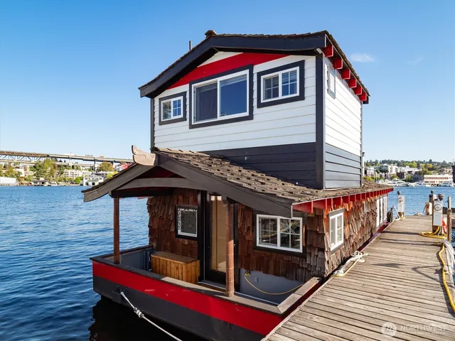 a view of a balcony with furniture and floor to ceiling window
