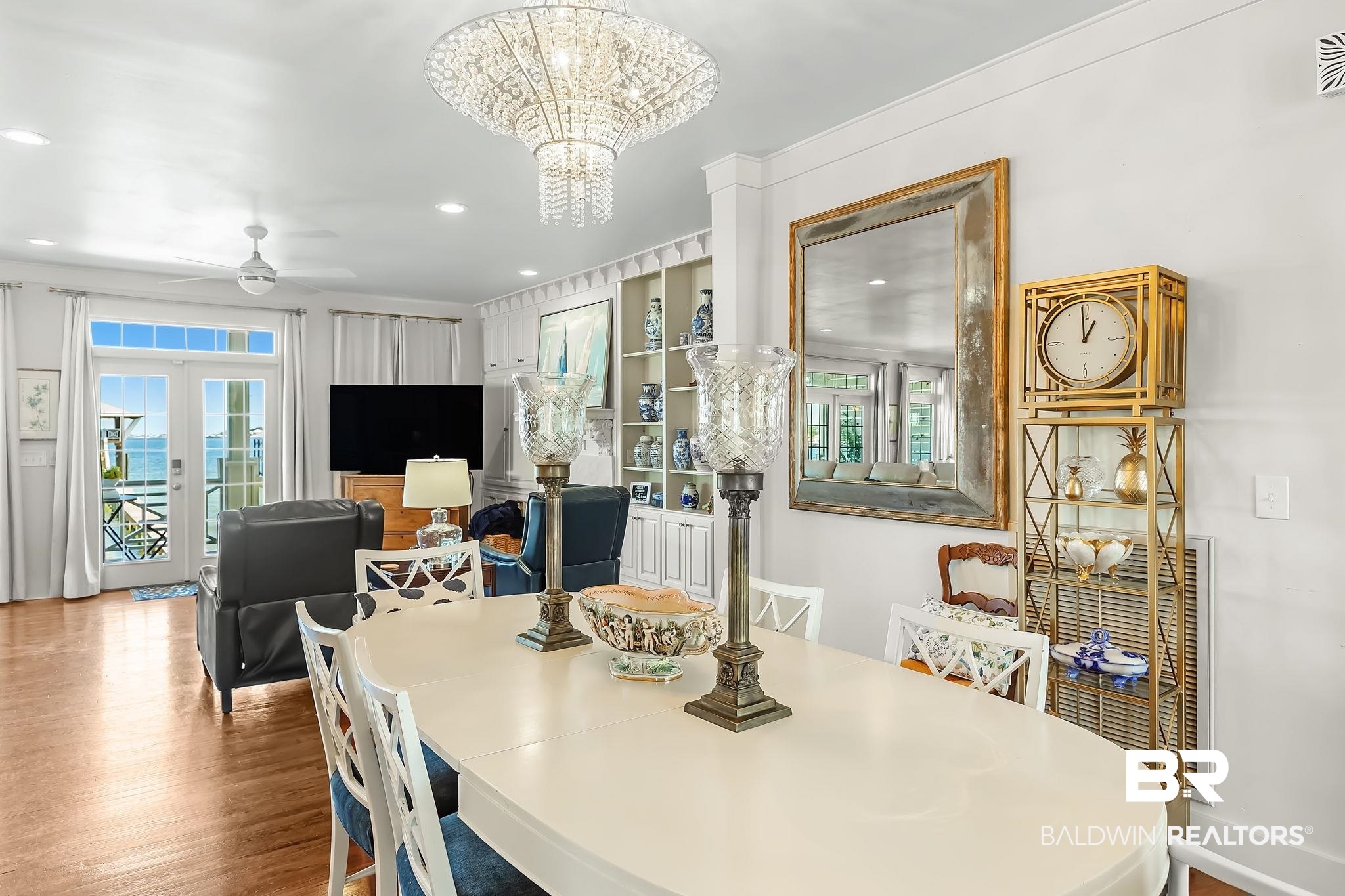 6434 County Road 95 Elberta, AL 36530 - Photo 16 of 99 Dining room featuring ceiling fan, french doors, a chandelier, and wood finished floors