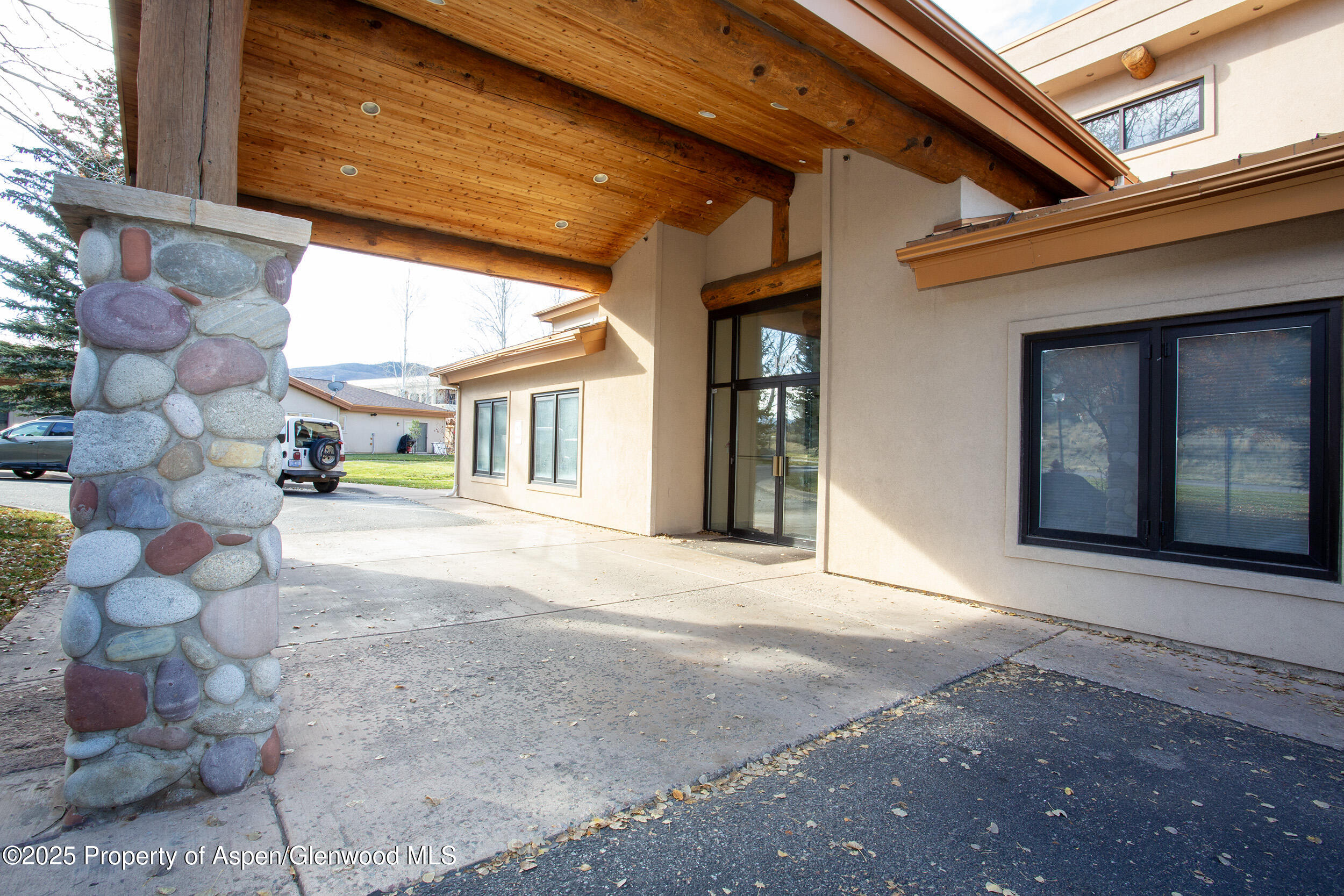 1400 East Valley Road, Unit 212 Basalt, CO 81621 - Photo 15 of 15 a view of a brick house with a large windows