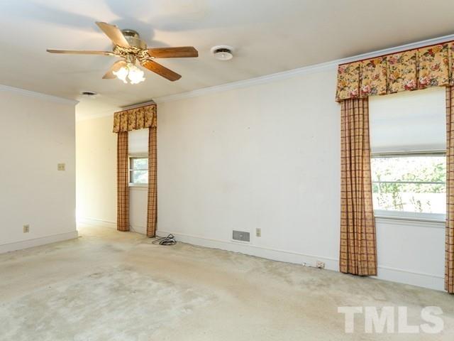3513 Brook Drive Raleigh, NC 27609 - Photo 11 of 30 an empty room with windows and fan