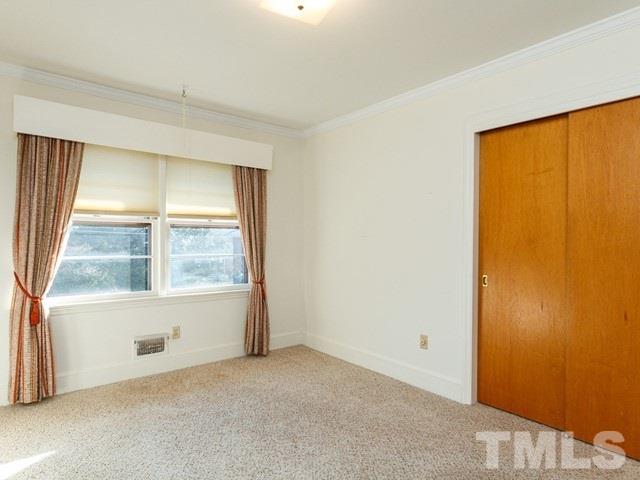 3513 Brook Drive Raleigh, NC 27609 - Photo 16 of 30 an empty room with a window