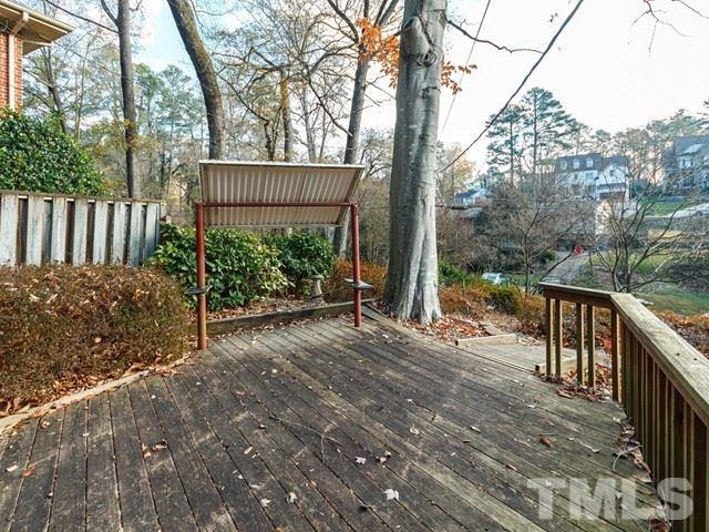 3513 Brook Drive Raleigh, NC 27609 - Photo 25 of 30 a view of a house with backyard and trees