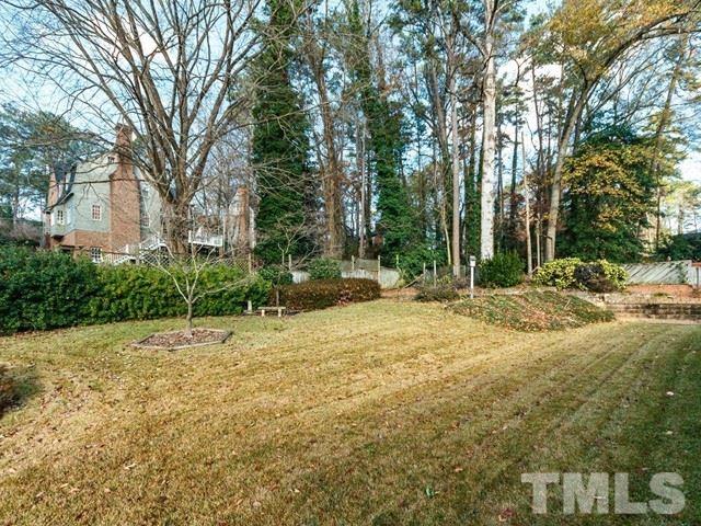 3513 Brook Drive Raleigh, NC 27609 - Photo 28 of 30 a backyard of a house with lots of green space
