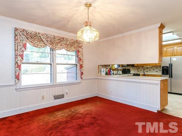 3513 Brook Drive Raleigh, NC 27609 - Photo 6 of 30 a view of an empty room with a window