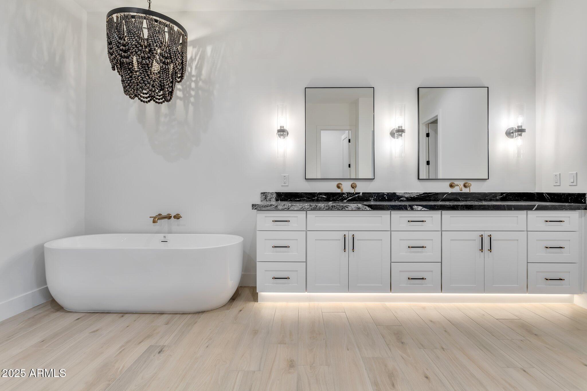 1602 East Cloud Road Phoenix, AZ 85086 - Photo 24 of 45 a spacious bathroom with a granite countertop sink and a mirror