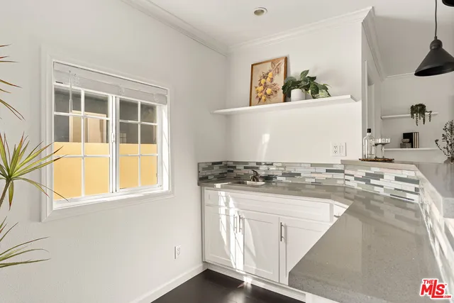 a kitchen with a stove and a sink