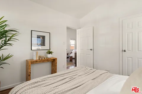 a bedroom with a bed and a table