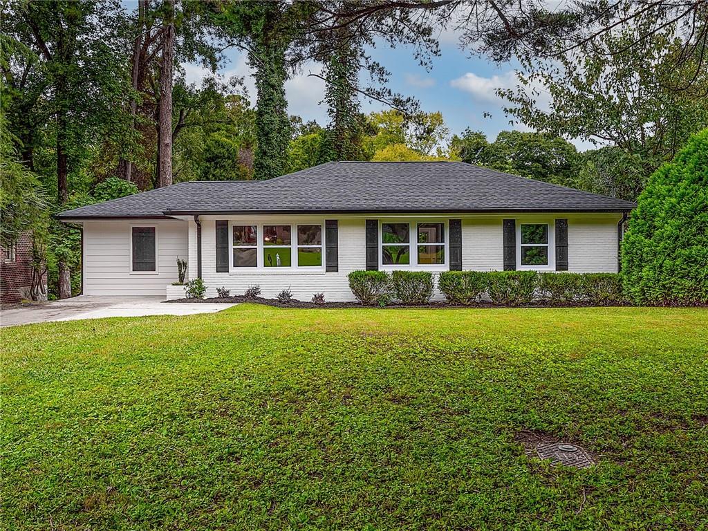 2068 Juanita Street Decatur, GA 30032 - Photo 1 of 1 a front view of a house with yard patio and green space