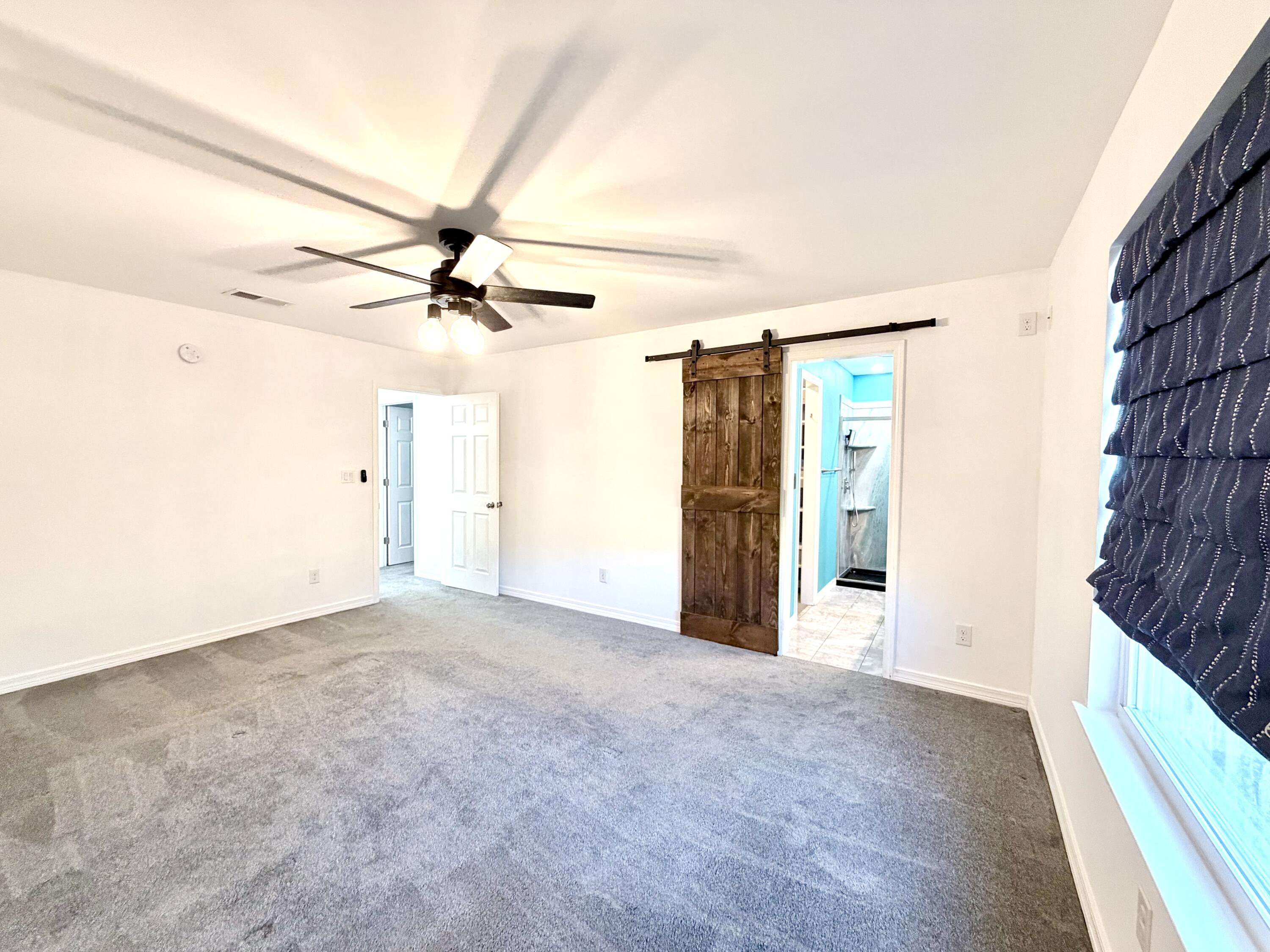 1765 Old Ranch Road Fort Walton Beach, FL 32547 - Photo 11 of 31 a view of a livingroom with a ceiling fan and window