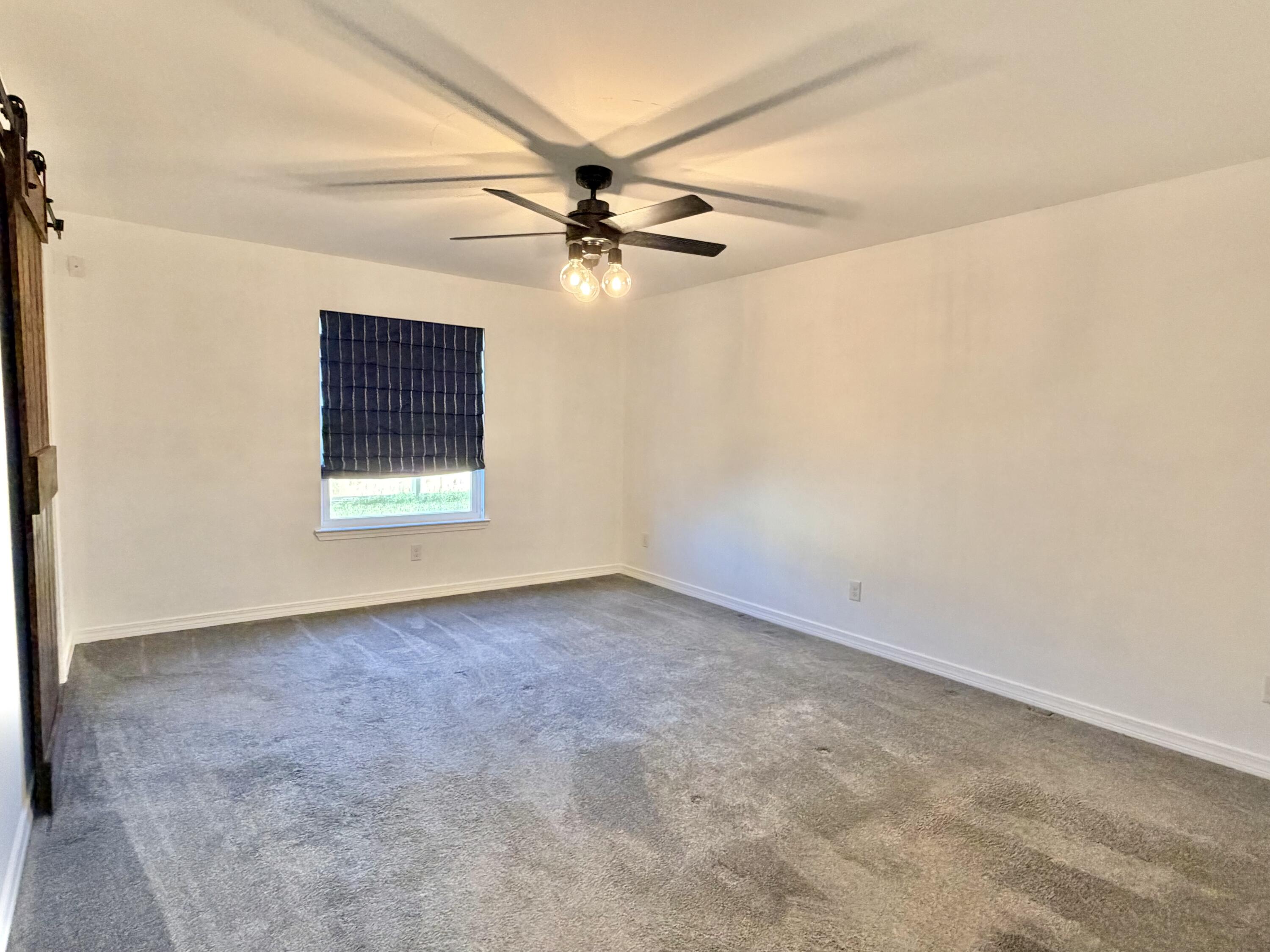 1765 Old Ranch Road Fort Walton Beach, FL 32547 - Photo 21 of 31 an empty room with windows and fan
