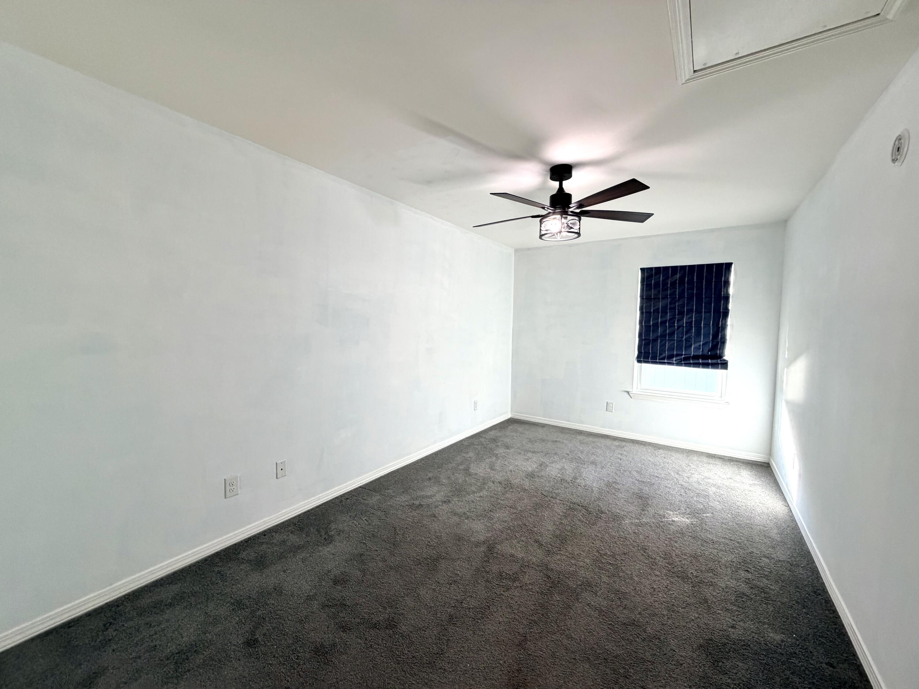 1765 Old Ranch Road Fort Walton Beach, FL 32547 - Photo 25 of 31 an empty room with a ceiling fan and a window