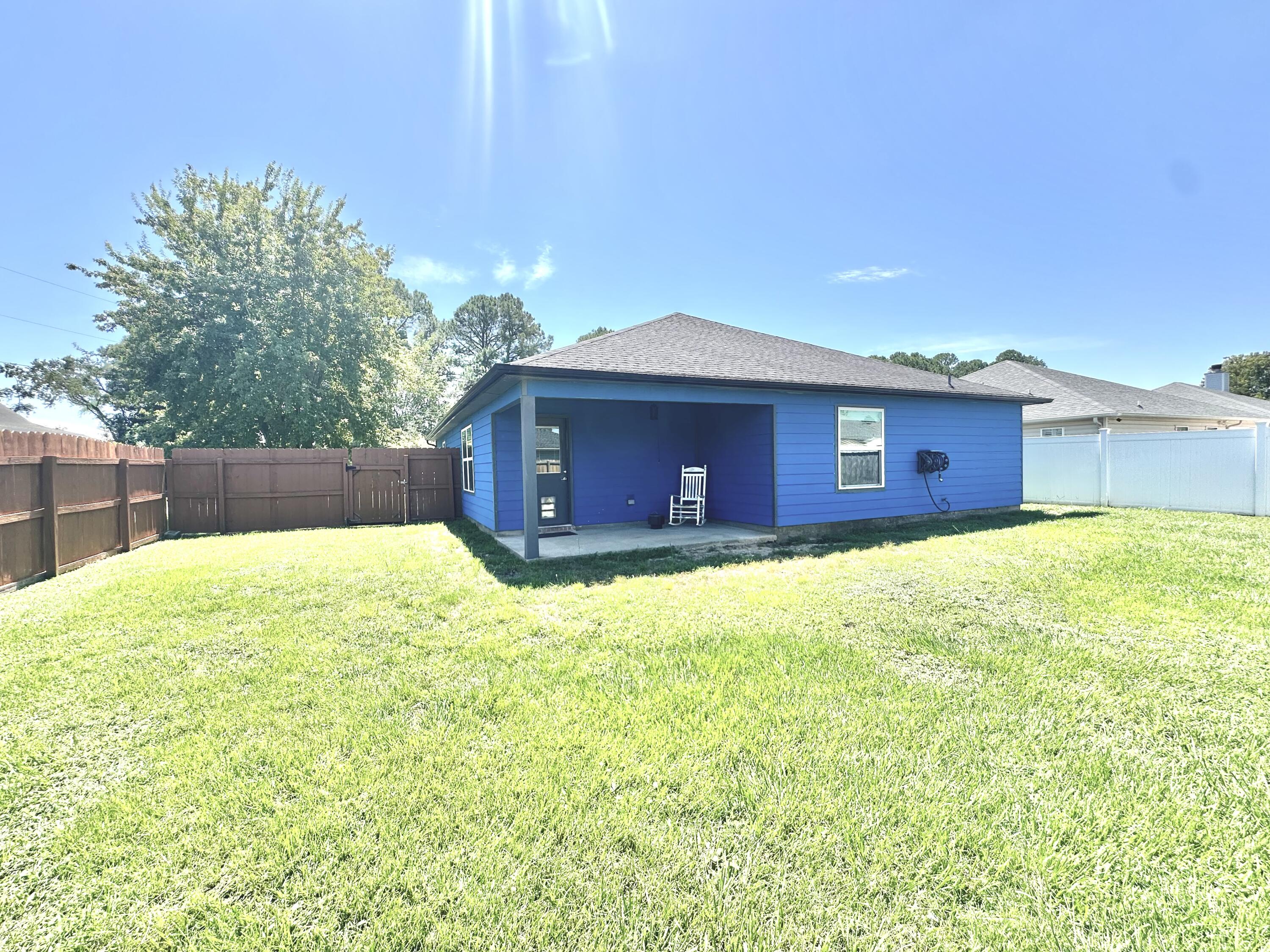 1765 Old Ranch Road Fort Walton Beach, FL 32547 - Photo 28 of 31 a view of a house with a backyard
