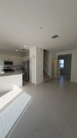 a view of a kitchen with furniture and a kitchen