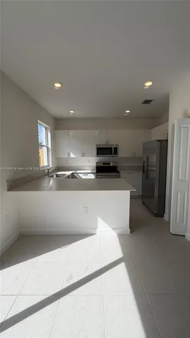 a view of a kitchen with a sink