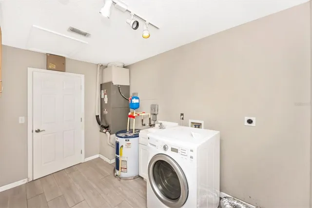 a view of a storage & utility room with washer and dryer