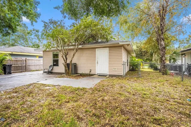 a view of a house with a yard and garage