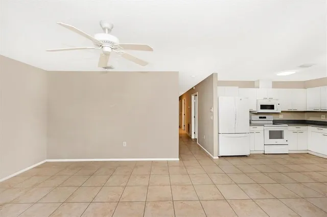 a view of a kitchen with electric appliances