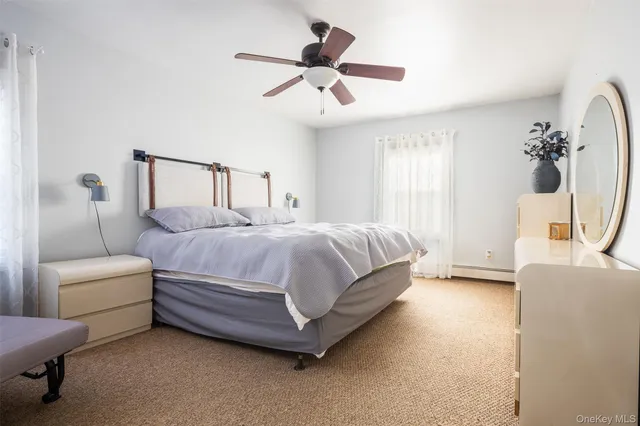 a spacious bedroom with a bed and a couch