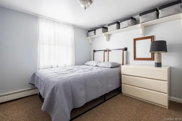 a bed room with a bed and a lamp