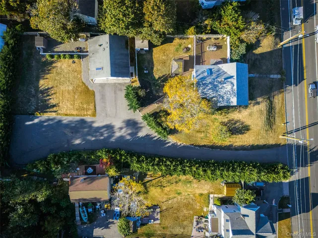 an aerial view of residential houses with outdoor space