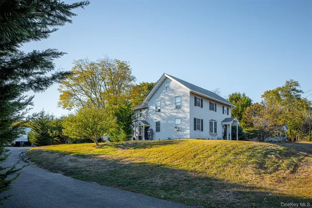 a house with swimming pool in front of it