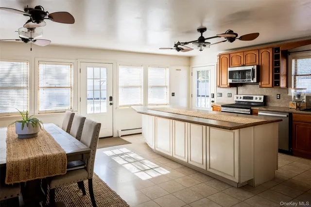 a kitchen with sink and refrigerator