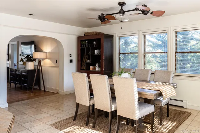 a view of a dining room with furniture window and outside view