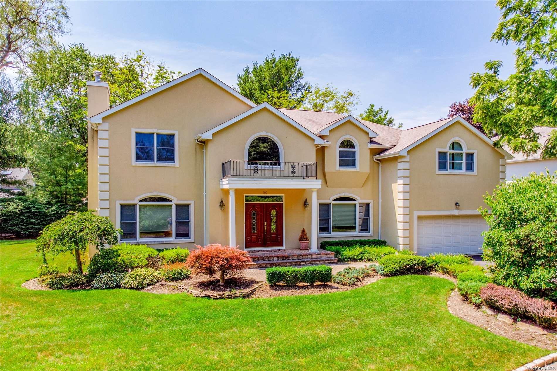 160 Convent Road Syosset, NY 11791 - Photo 1 of 1 a front view of a house with a yard and potted plants