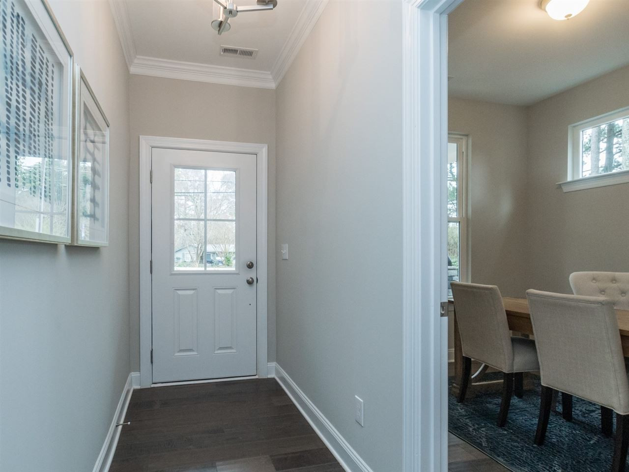 512 Jones Franklin Road Raleigh, NC 27606 - Photo 8 of 23 FRONT ENTRY HALL WITH VIEW OF THE MAIN LEVEL BEDROOM