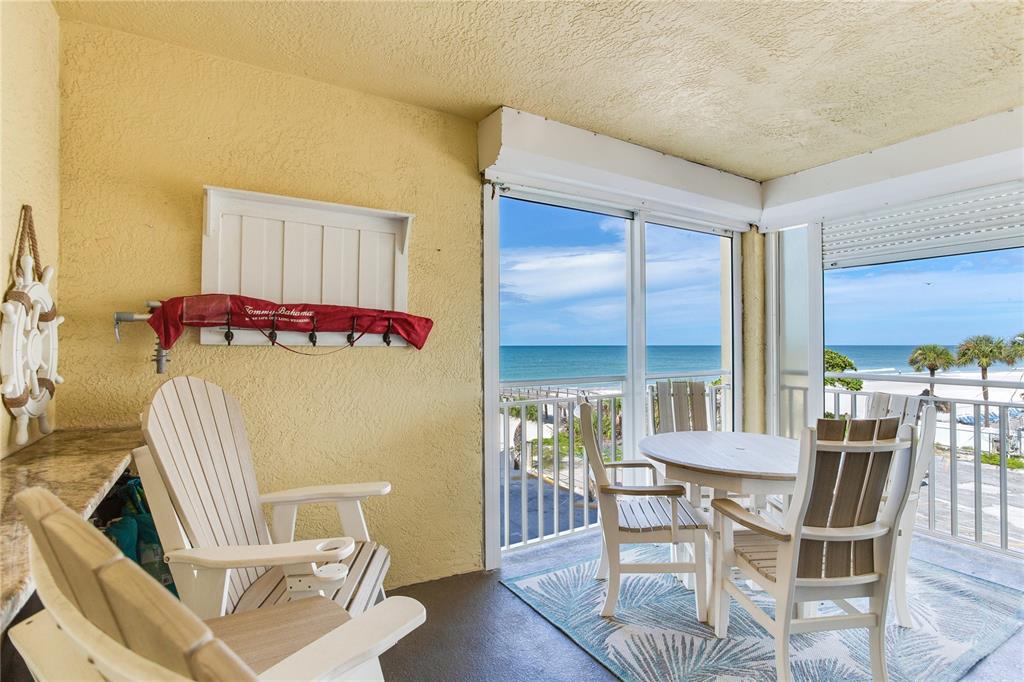 17450 Gulf Boulevard, Unit 206 Redington Shores, FL 33708 - Photo 13 of 52 a view of a dining room with furniture window and wooden floor
