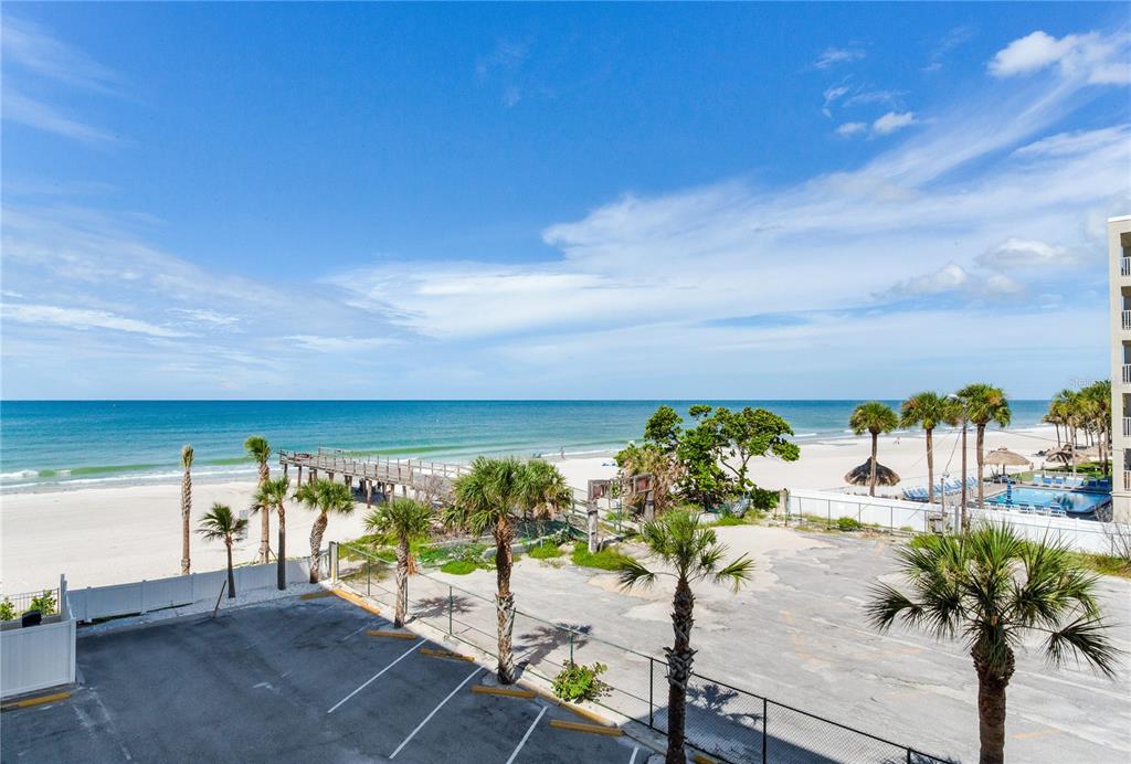 17450 Gulf Boulevard, Unit 206 Redington Shores, FL 33708 - Photo 16 of 52 a view of a chairs and table on the terrace