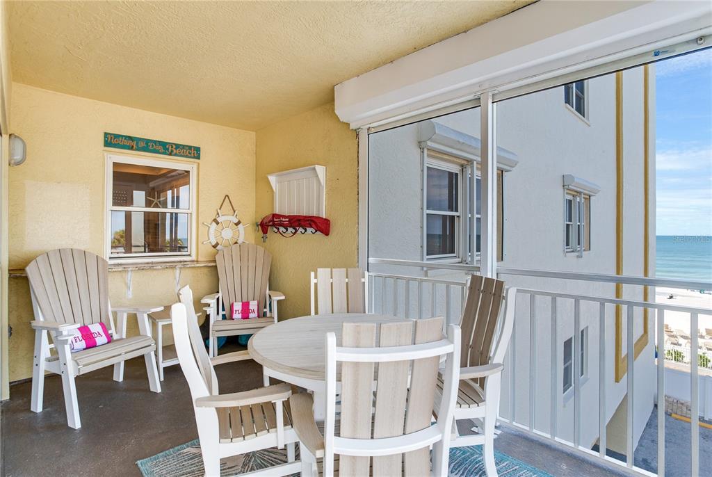 17450 Gulf Boulevard, Unit 206 Redington Shores, FL 33708 - Photo 19 of 52 a view of a dining room with furniture and rug floor