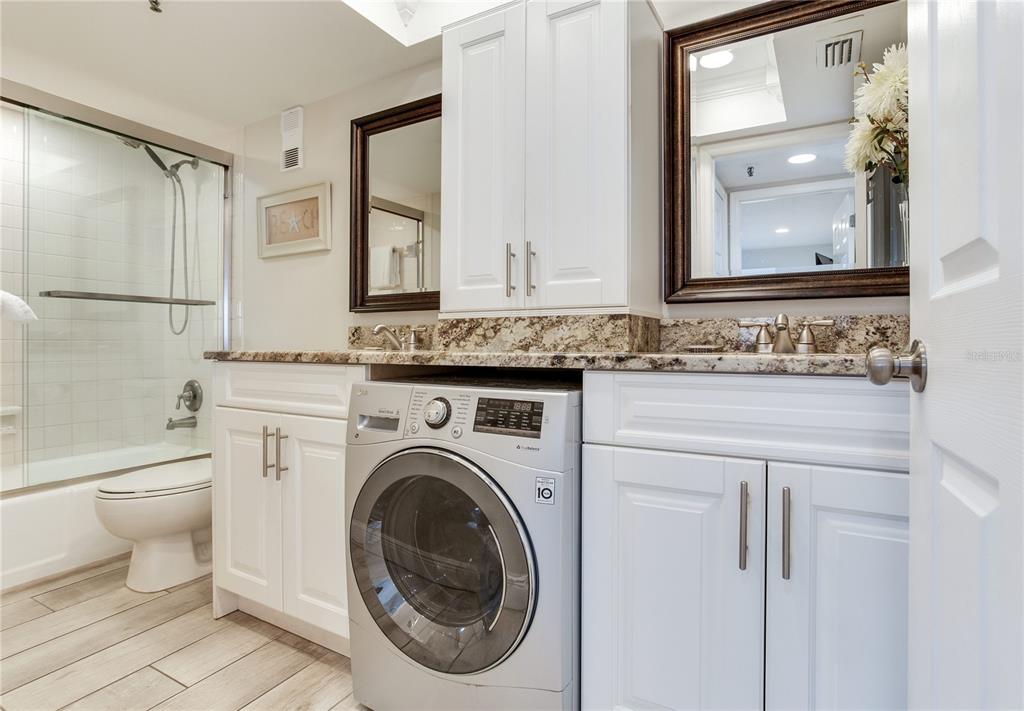 17450 Gulf Boulevard, Unit 206 Redington Shores, FL 33708 - Photo 36 of 52 a bathroom with a sink vanity mirror and toilet