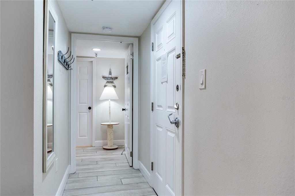 17450 Gulf Boulevard, Unit 206 Redington Shores, FL 33708 - Photo 38 of 52 a view of a bathroom from a hallway