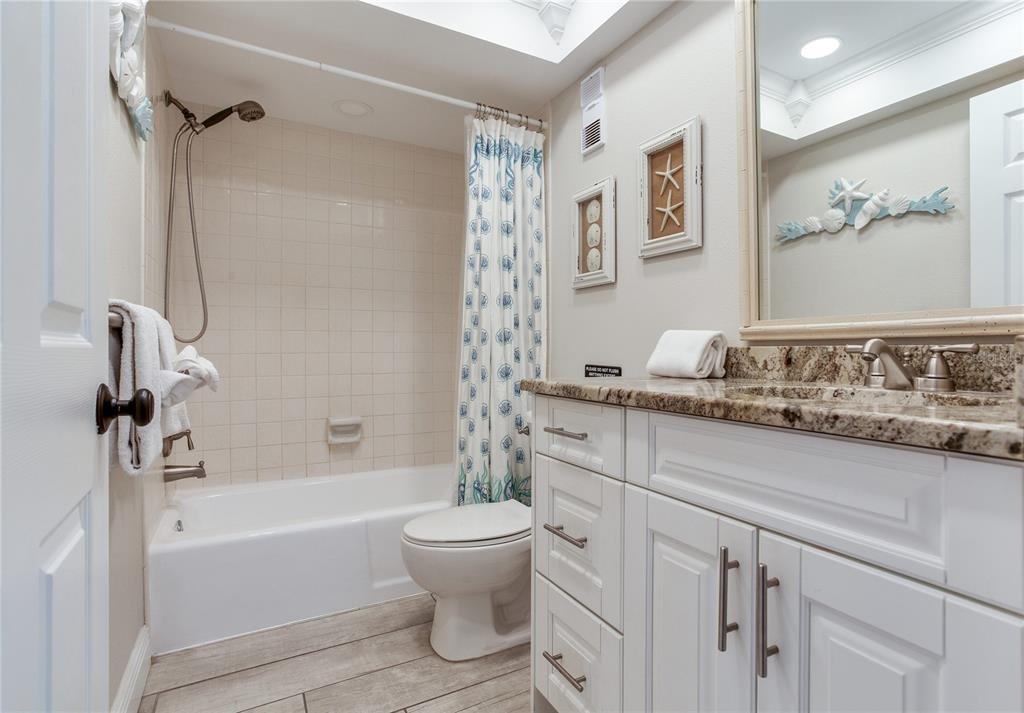 17450 Gulf Boulevard, Unit 206 Redington Shores, FL 33708 - Photo 43 of 52 a bathroom with a sink a toilet and a bathtub